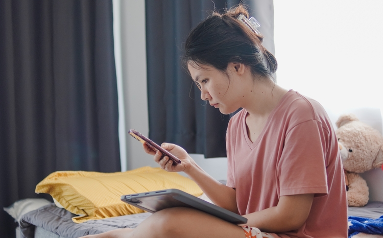 woman looking at smartphone