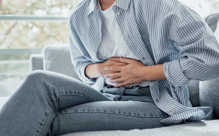 Sick,Young,Woman,In,Pain,Holding,Belly,Stomach,Feeling,Hurt