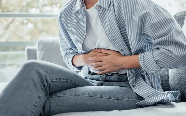 Sick,Young,Woman,In,Pain,Holding,Belly,Stomach,Feeling,Hurt