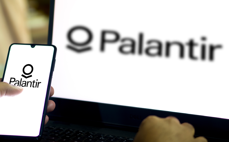 Palantir logo on mobile phone screen and laptop screen