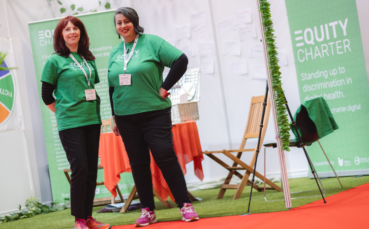 Ayesha Rahim (right) and Victoria Betton (left) at the Equity Charter stand on the showfloor of Rewired 2025