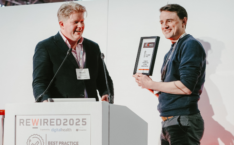 Chris Chaney, chief executive of CW+ (left), presents the Pitchfest award to Benjamin Beaumont, chief technology officer at Daysix (right) at Rewired 2025