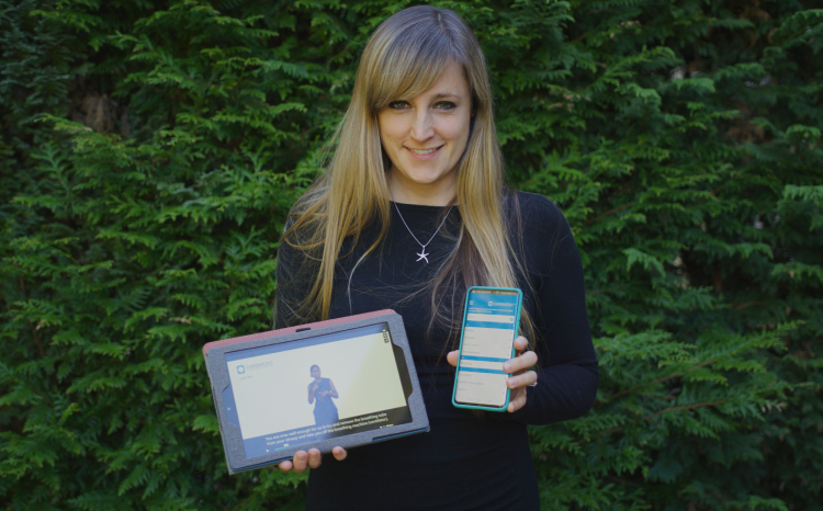 Dr Rachael Grimaldi, co-founder of CardMedic, showcasing the app on tablet and smartphone