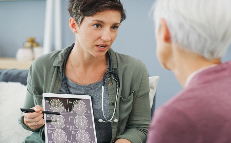 Woman,,Doctor,And,Brain,Scan,With,Tablet,,Xray,And,Mri