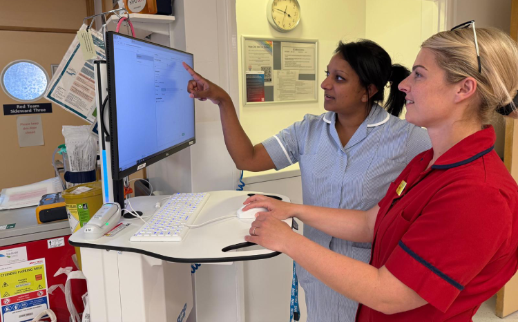 Sapna Davies and Hannah Cheesman using the Apollo EPR system on Powys Ward